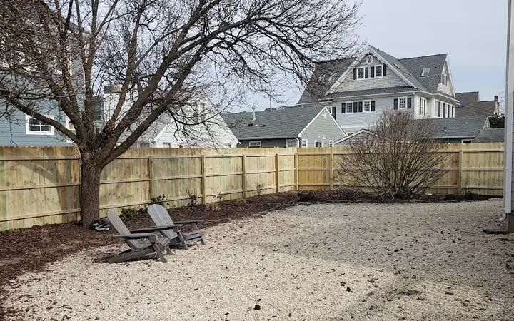 New wood privacy fence around a large backyard